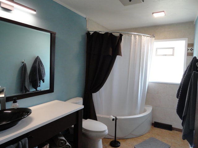 full bathroom featuring tile patterned flooring, shower / bath combination with curtain, toilet, and vanity