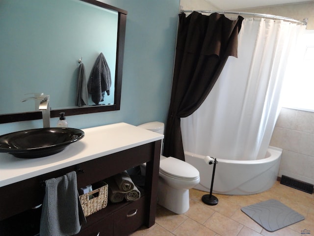 full bathroom with toilet, shower / tub combo, vanity, and tile patterned floors