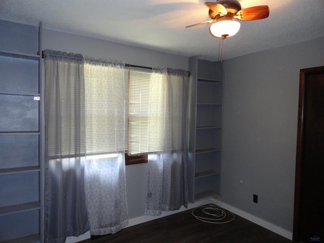 unfurnished room with ceiling fan