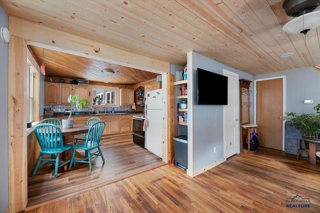 kitchen with sink, white fridge, light hardwood / wood-style flooring, wooden ceiling, and black electric range oven