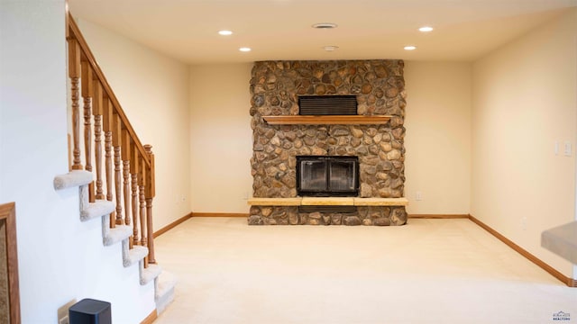 living room featuring a fireplace and carpet flooring