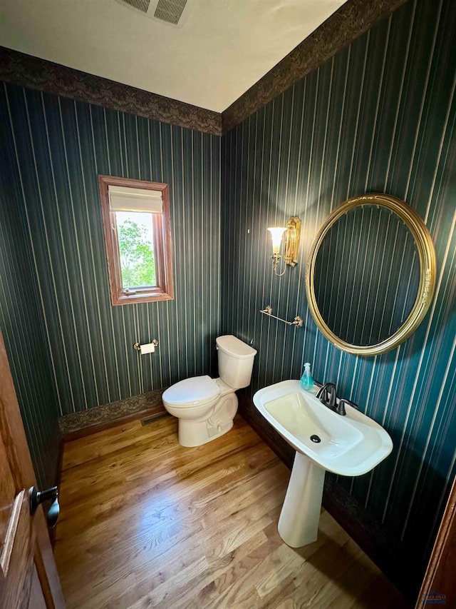 bathroom featuring toilet and hardwood / wood-style floors