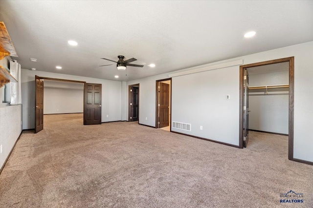 unfurnished bedroom featuring recessed lighting, carpet flooring, and a textured ceiling