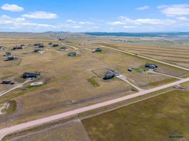 birds eye view of property featuring a rural view