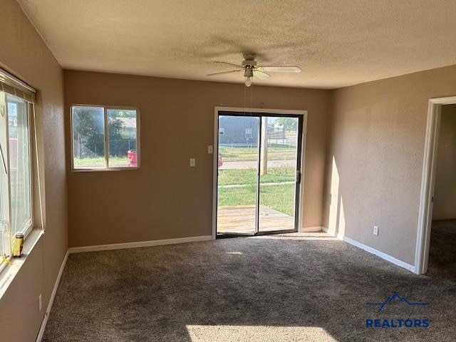 unfurnished room featuring carpet, a textured ceiling, and ceiling fan