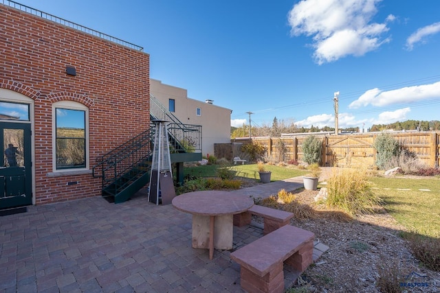 619 Mt Rushmore Rd, Custer, SD 57730 - fenced backyard with a patio area and stairway