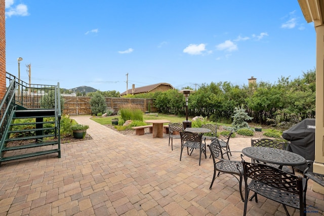 619 Mt Rushmore Rd, Custer, SD 57730 - view of patio featuring outdoor dining area, a gate, and a grill
