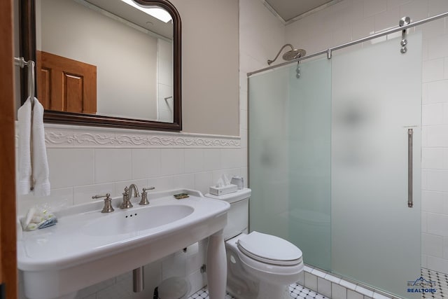 bathroom with tile patterned flooring, tile walls, walk in shower, and backsplash