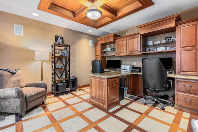 office area featuring coffered ceiling, beamed ceiling, and built in desk