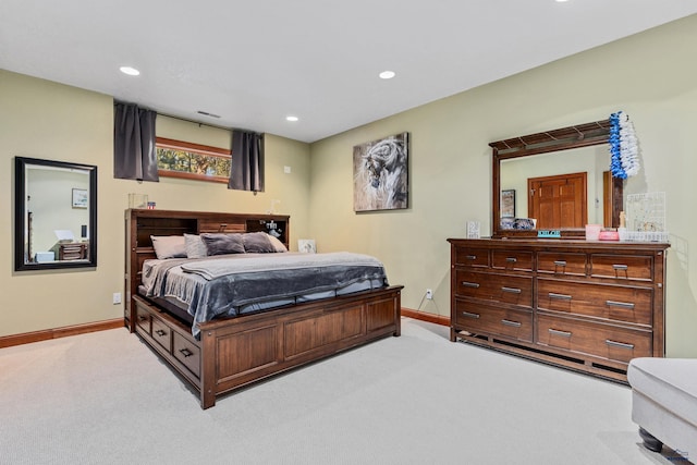 bedroom featuring light carpet