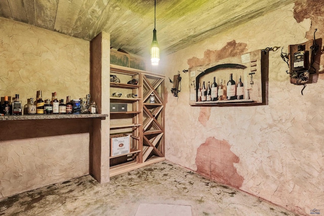 wine cellar featuring concrete floors