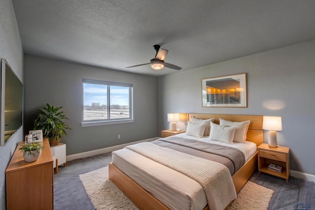 bedroom with ceiling fan, a textured ceiling, and carpet flooring