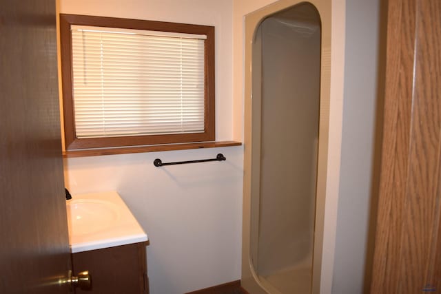 bathroom with vanity and walk in shower