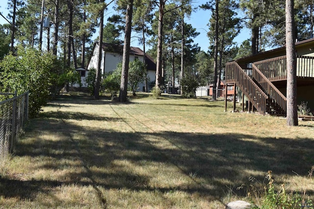 view of yard featuring a wooden deck