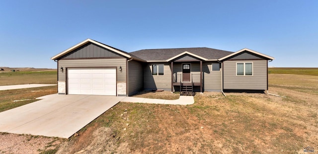 ranch-style home with a front yard and a garage