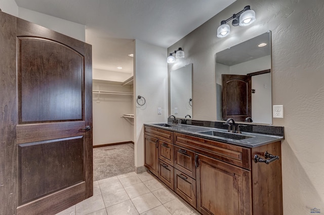 bathroom featuring tile patterned floors and vanity