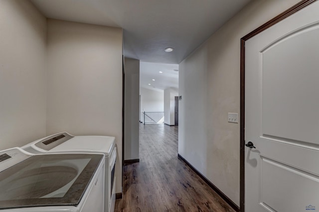 clothes washing area featuring independent washer and dryer and dark hardwood / wood-style floors