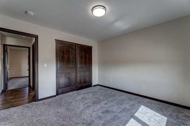 unfurnished bedroom with a closet and carpet