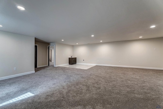 unfurnished living room with light carpet