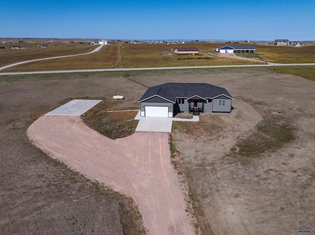 birds eye view of property with a rural view