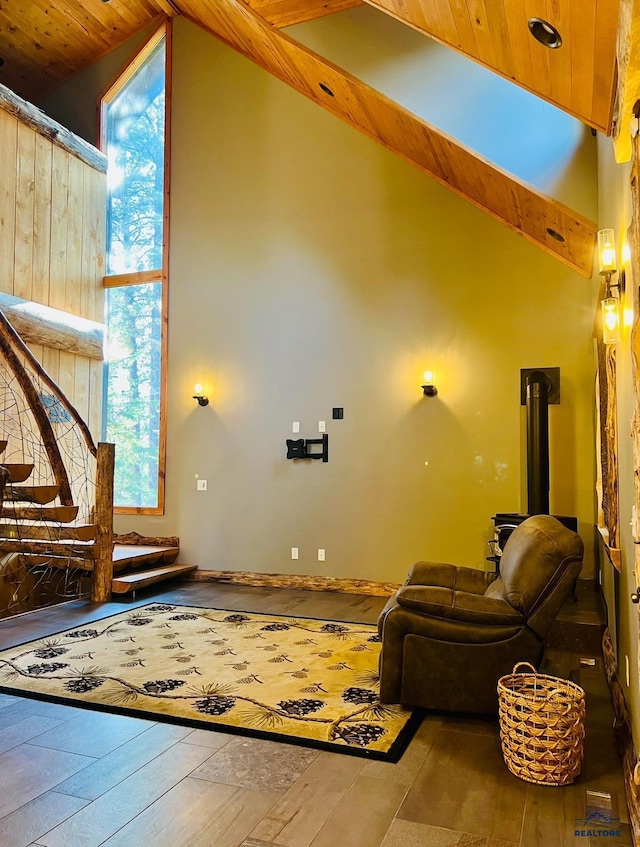 living room with high vaulted ceiling, a wood stove, wood-type flooring, and wood ceiling