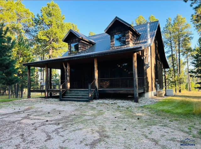 view of front of house with a porch and metal roof