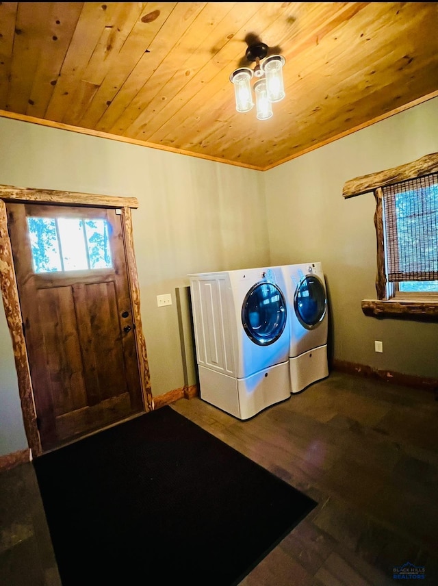 clothes washing area with crown molding, laundry area, washer and dryer, wooden ceiling, and wood finished floors