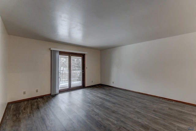 spare room featuring hardwood / wood-style flooring