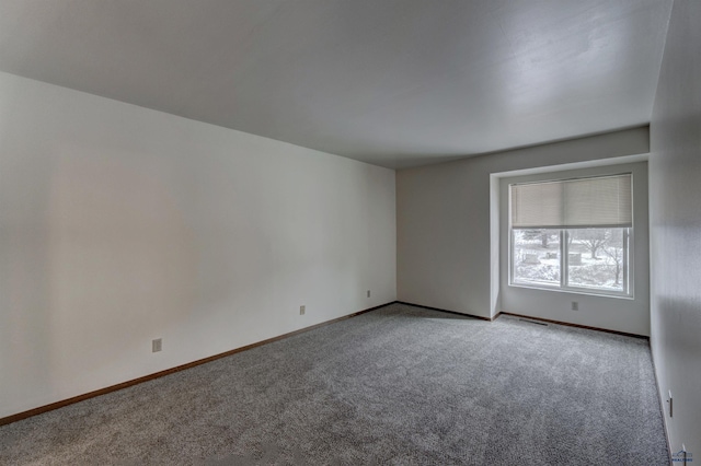 spare room with light colored carpet