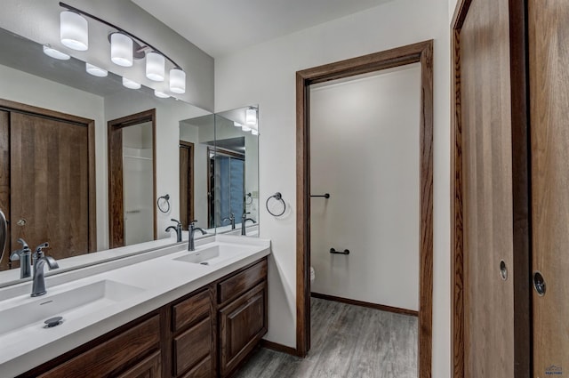 bathroom featuring hardwood / wood-style floors and vanity