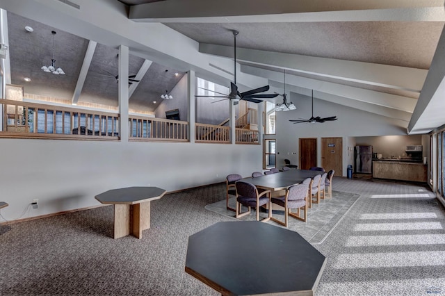 interior space featuring carpet flooring, ceiling fan, high vaulted ceiling, and beam ceiling