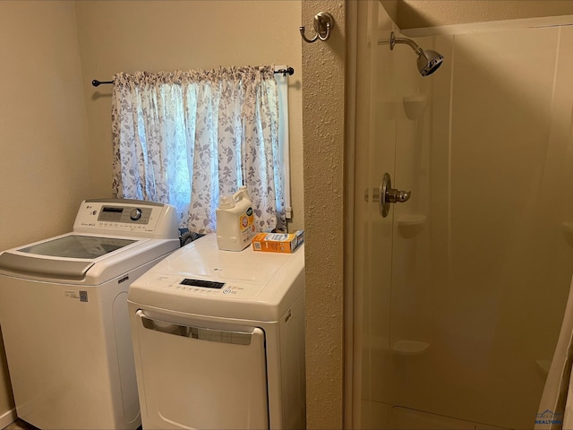 laundry room featuring washing machine and clothes dryer