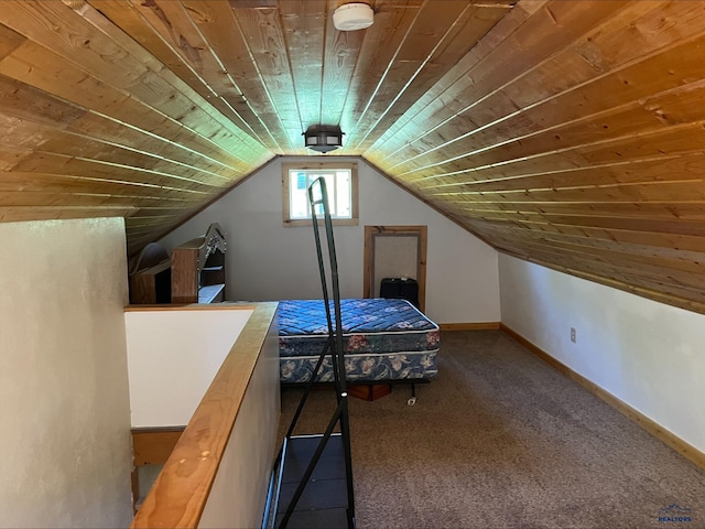 unfurnished bedroom with wood ceiling, vaulted ceiling, and carpet floors