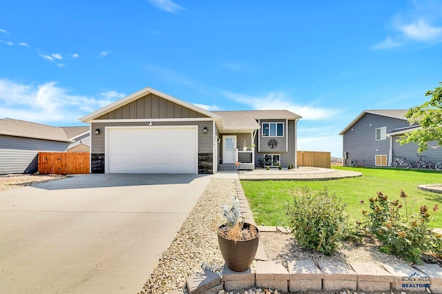 single story home featuring a front yard and a garage