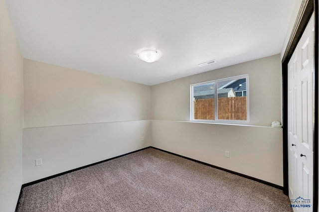 unfurnished room with carpet floors