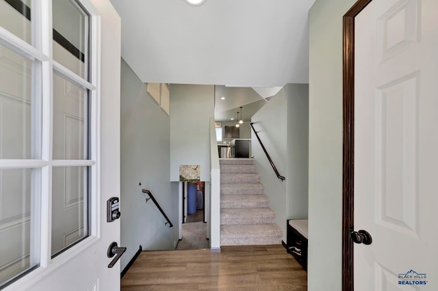 staircase featuring hardwood / wood-style flooring