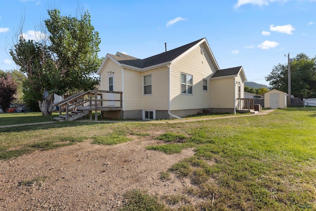 view of property exterior featuring a yard and a shed