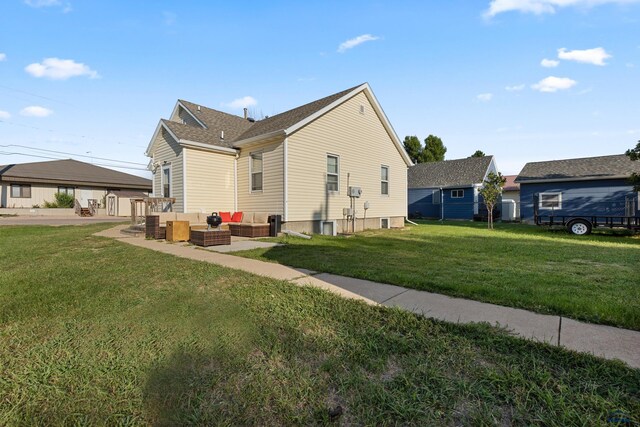 view of side of home featuring a yard