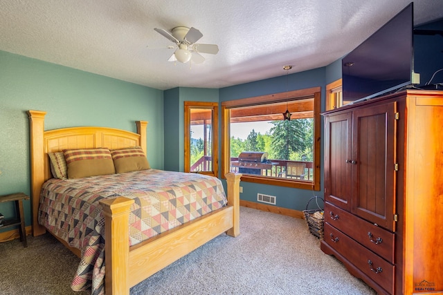 21169 Last Chance Trl, Lead, SD 57754 - bedroom featuring light colored carpet, baseboards, a textured ceiling, and ceiling fan