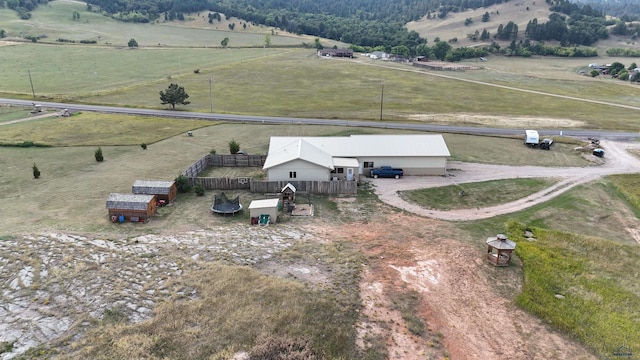 birds eye view of property with a rural view