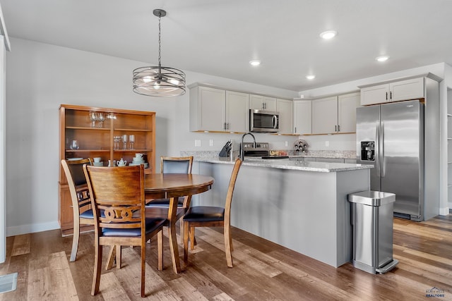 interior space with light hardwood / wood-style flooring and a chandelier