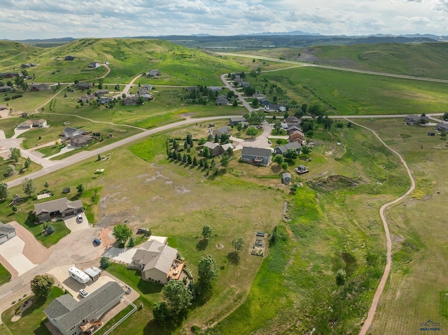 birds eye view of property with a rural view