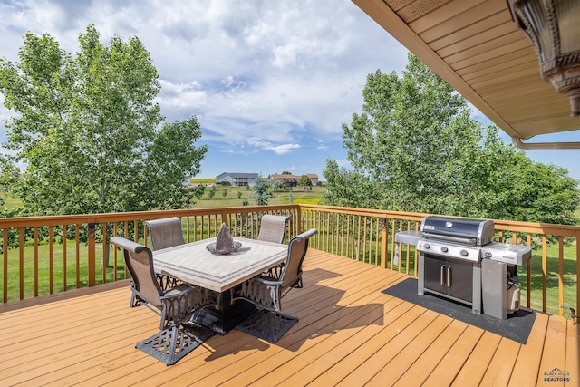 wooden deck featuring a yard