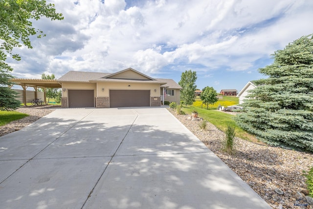 view of front of home with a garage and a carport