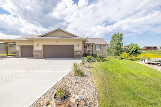 view of front of property featuring a garage and a front lawn