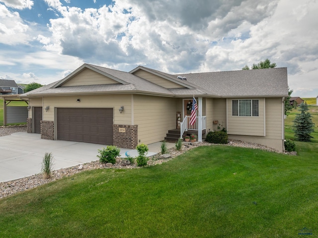 ranch-style house featuring a garage and a front lawn