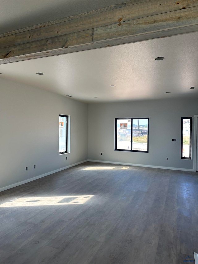 empty room featuring a textured ceiling and hardwood / wood-style floors