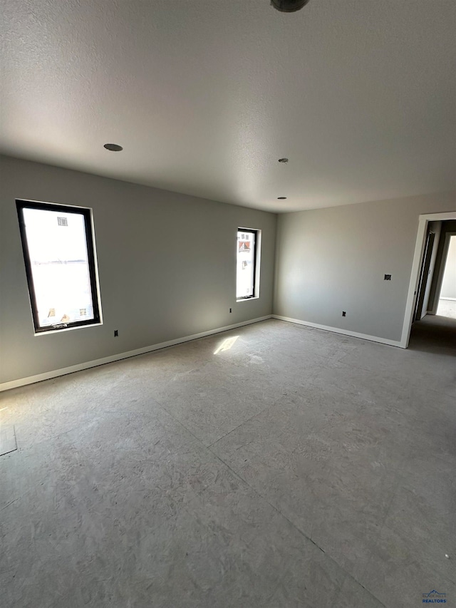 spare room featuring a textured ceiling