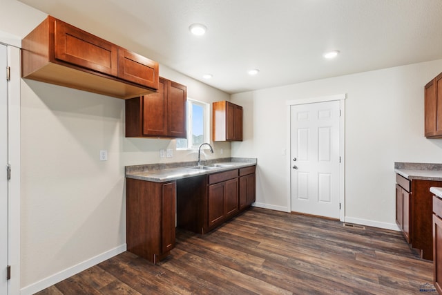 kitchen featuring dark hardwood / wood-style floors and sink