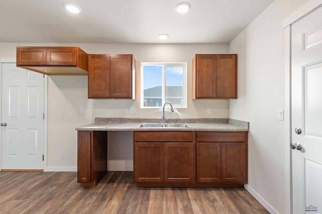 kitchen with dark wood-type flooring and sink